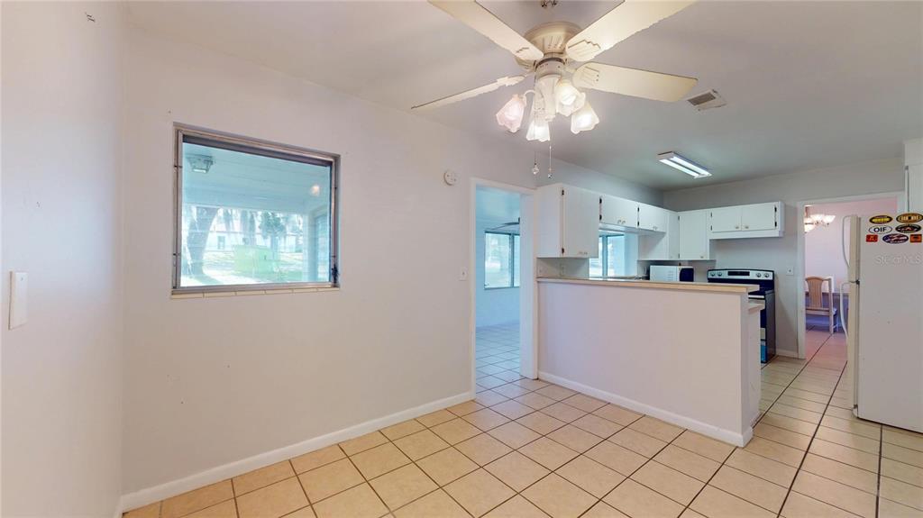 121 North Seminole Avenue Inverness, FL 34450 - Photo 14 of 47 a view of kitchen with cabinets and window