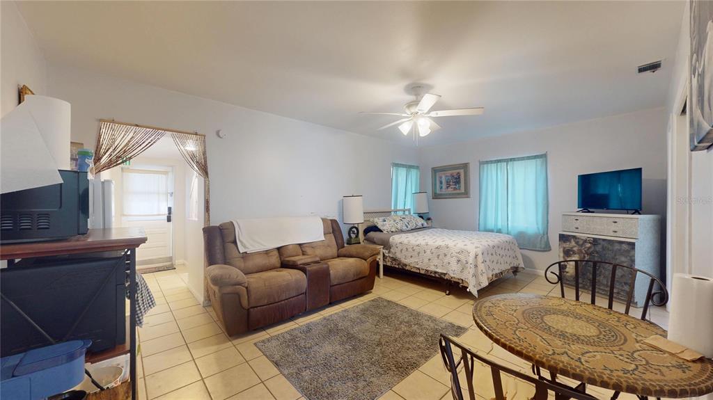 121 North Seminole Avenue Inverness, FL 34450 - Photo 15 of 47 a living room with furniture and a flat screen tv