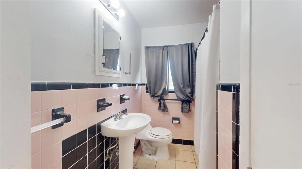 121 North Seminole Avenue Inverness, FL 34450 - Photo 25 of 47 a bathroom with a sink a toilet and mirror