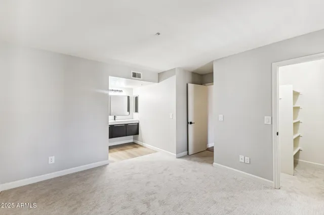 a view of a big room with a kitchen