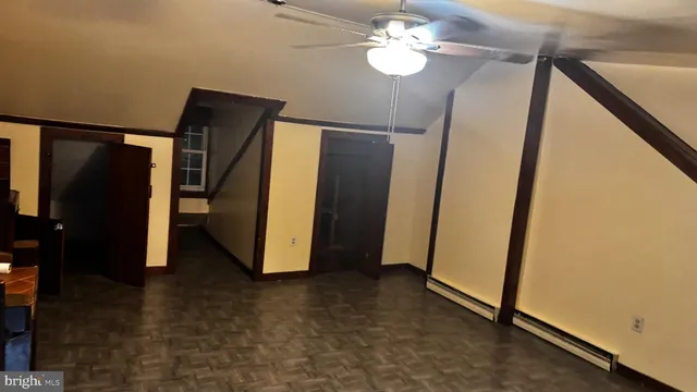 a view of a hallway with a bathroom