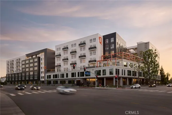 a tall building sitting on the side of a street