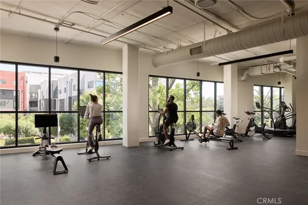 a dining room with furniture and chandelier