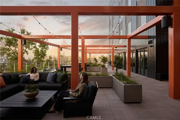 a room with lots of tables a large mirror and furniture