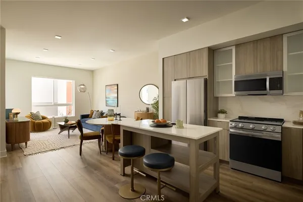 a view of kitchen with stainless steel appliances granite countertop a sink and a stove