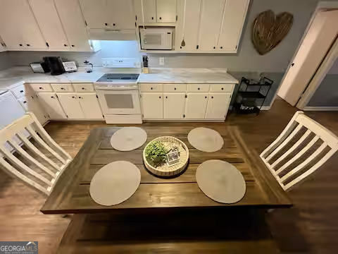 973 Barker Road Southwest Rome, GA 30165 - Photo 16 of 39 a kitchen with a stove a sink and a stove