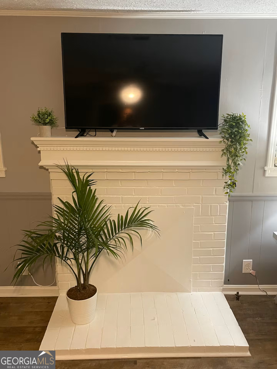 973 Barker Road Southwest Rome, GA 30165 - Photo 23 of 39 a view of a potted plant with a bench