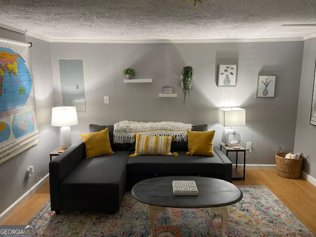 973 Barker Road Southwest Rome, GA 30165 - Photo 35 of 39 a living room with furniture and a lamp