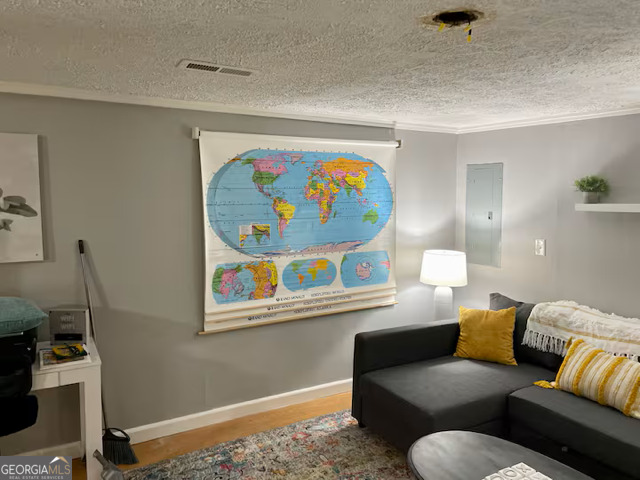 973 Barker Road Southwest Rome, GA 30165 - Photo 37 of 39 a living room with furniture and wall paintings