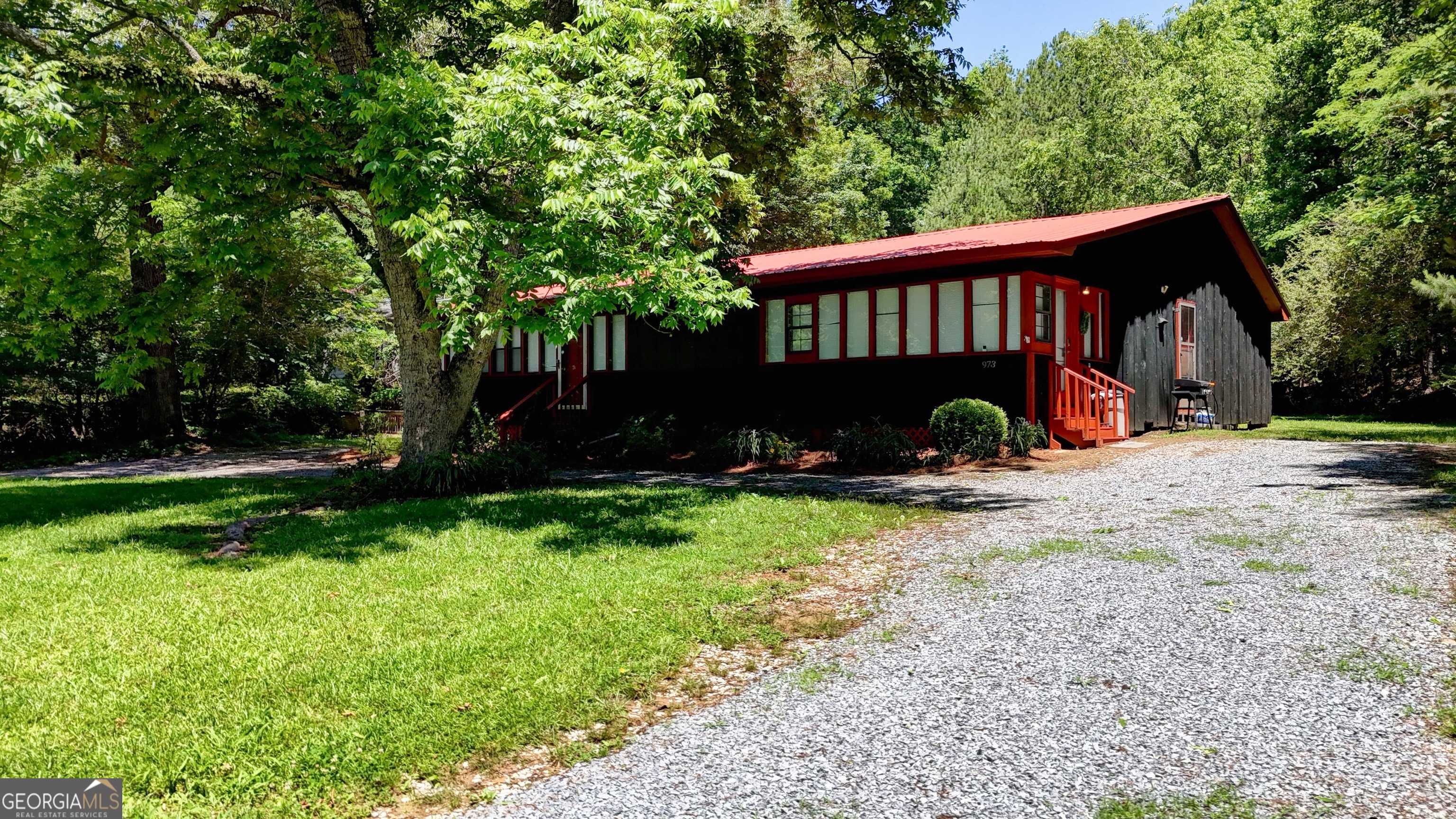 973 Barker Road Southwest Rome, GA 30165 - Photo 4 of 39 a view of a backyard with a garden and trees