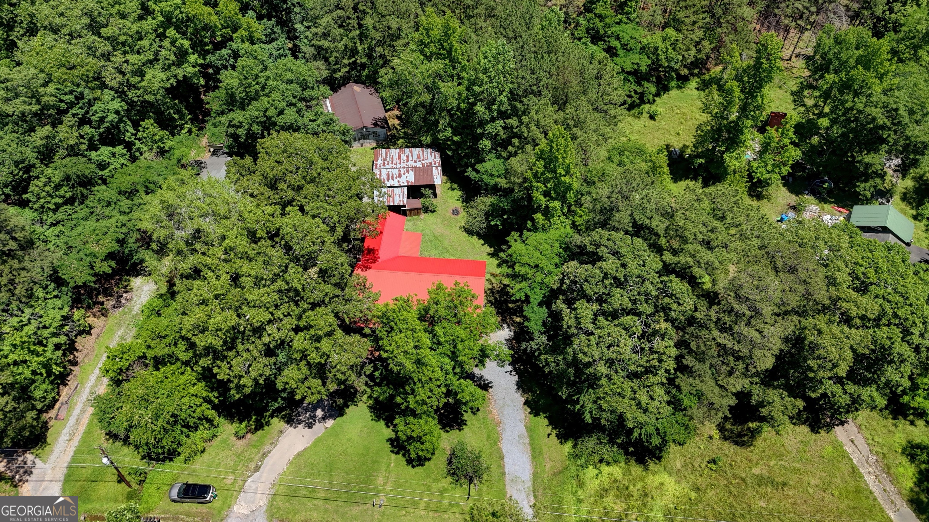 973 Barker Road Southwest Rome, GA 30165 - Photo 10 of 39 an aerial view of a house with a yard and lake view