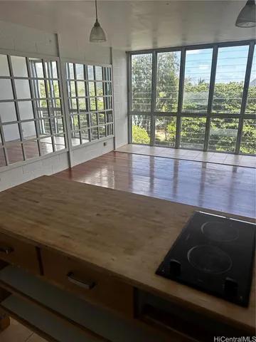 a view of wooden floor and kitchen living room
