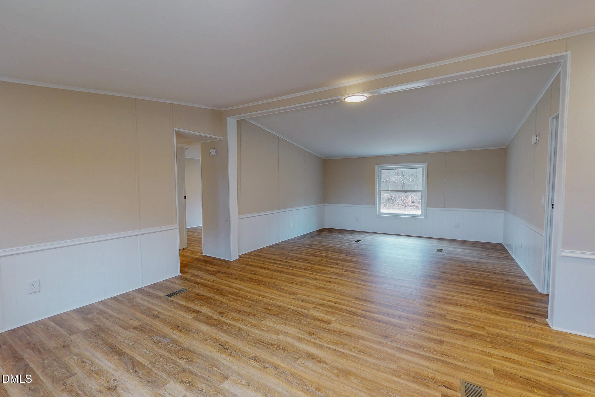 67 Halifax Road Roxboro, NC 27574 - Photo 9 of 48 a view of empty room with wooden floor and fan