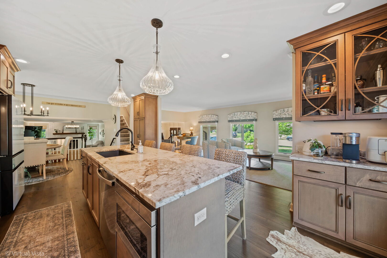 506 South Raven Road Shorewood, IL 60404 - Photo 13 of 37 a kitchen with stainless steel appliances granite countertop a sink a stove and chairs