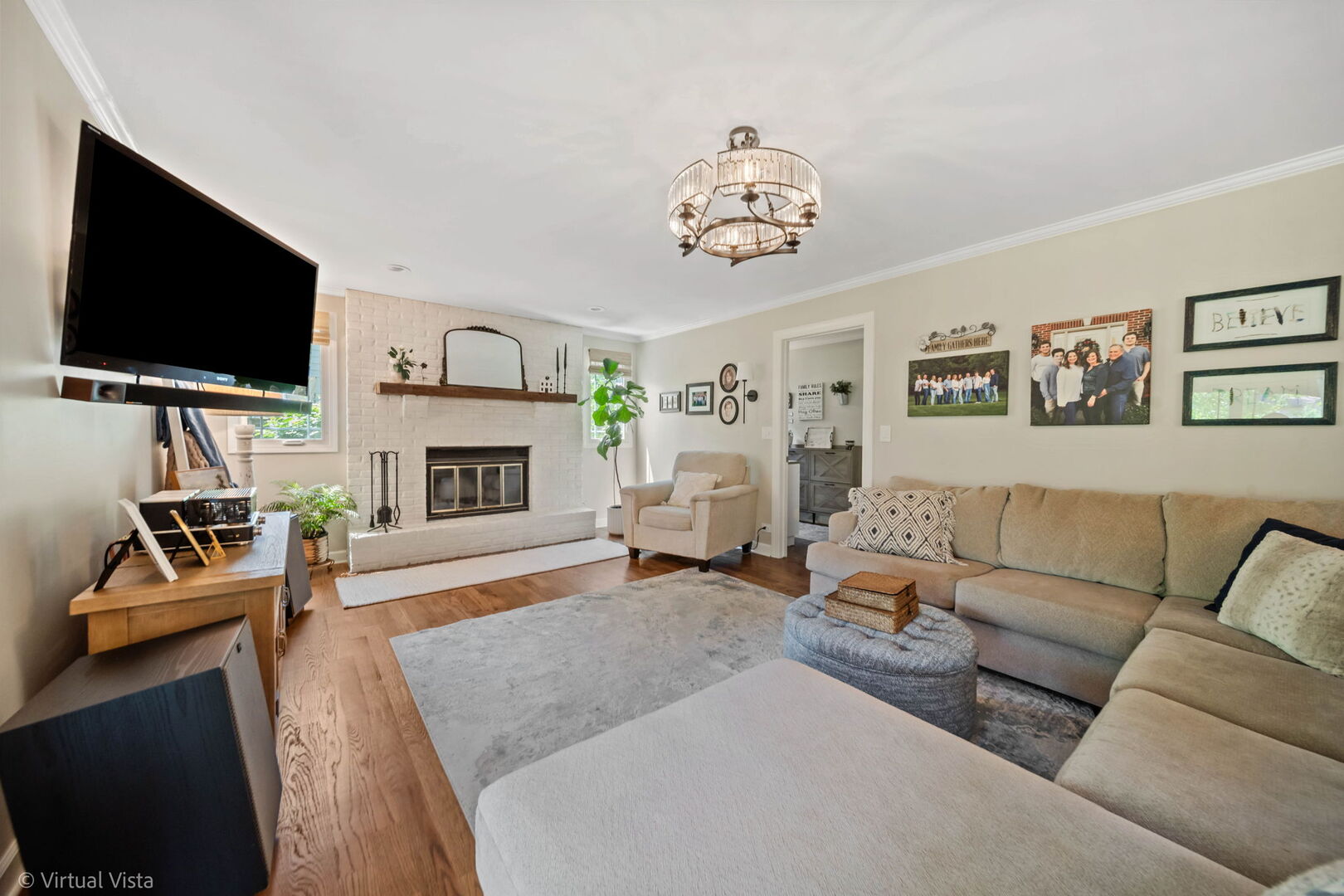 506 South Raven Road Shorewood, IL 60404 - Photo 18 of 37 a living room with furniture a flat screen tv and a fireplace