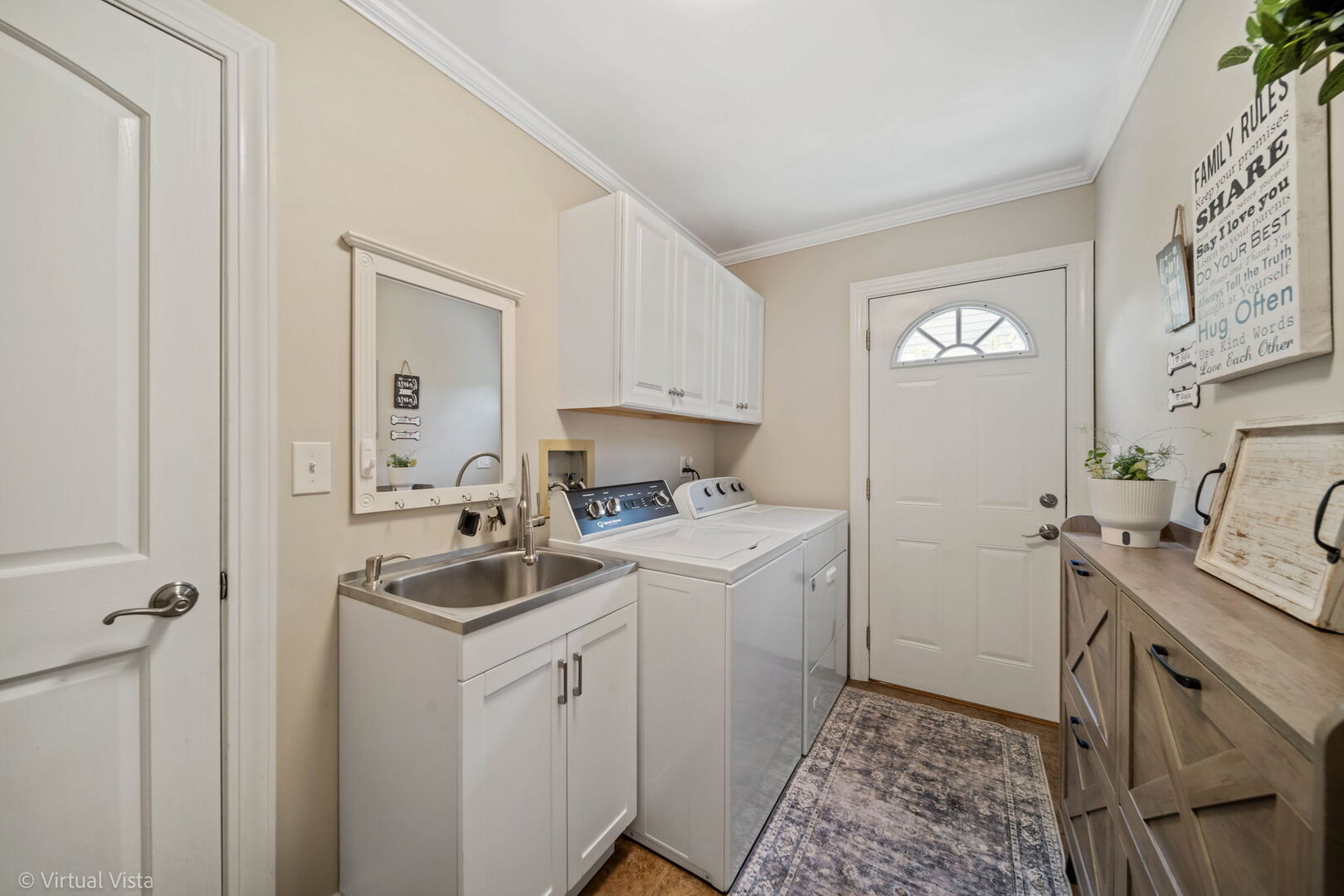 506 South Raven Road Shorewood, IL 60404 - Photo 21 of 37 a room with a sink and a washer dryer
