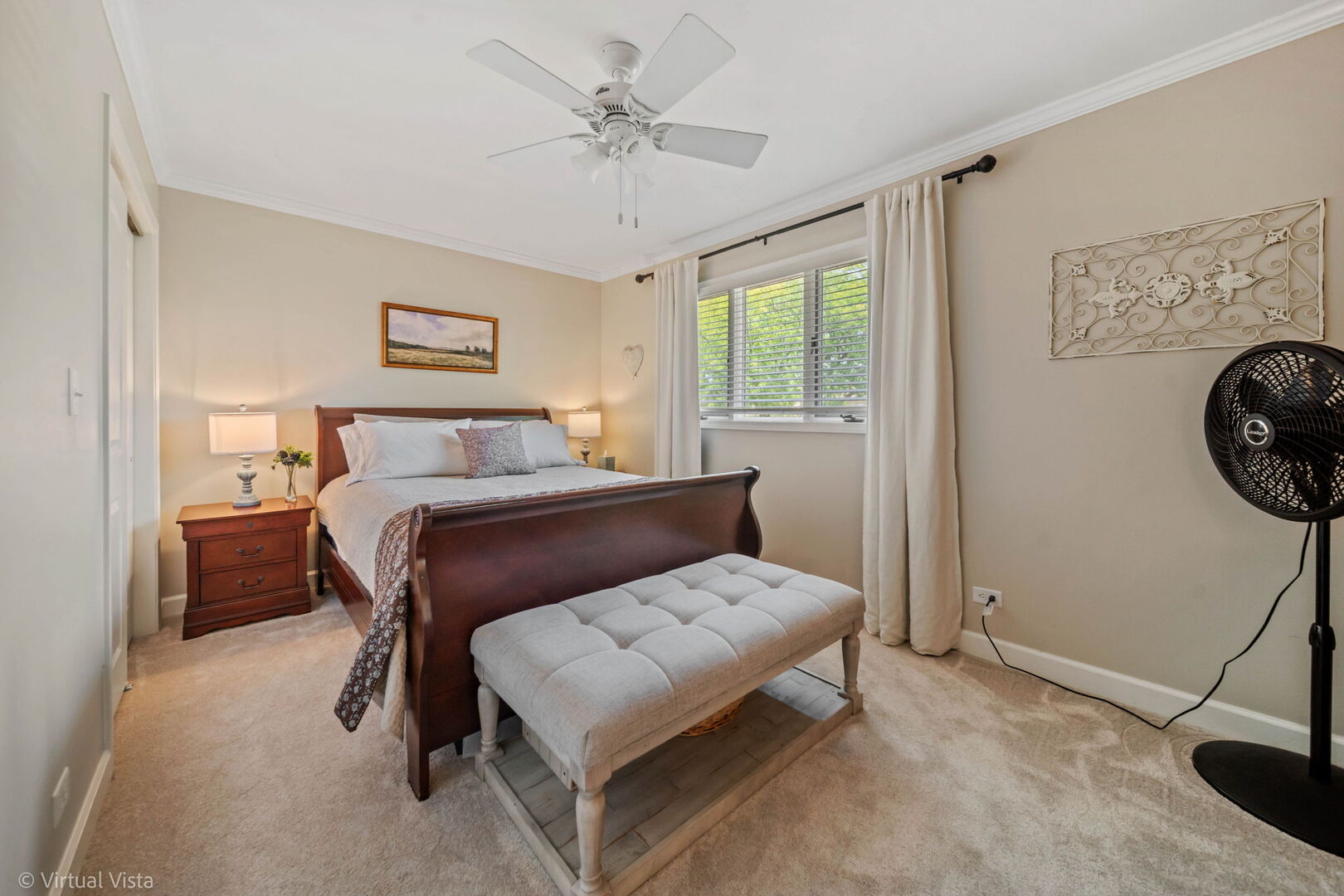 506 South Raven Road Shorewood, IL 60404 - Photo 22 of 37 a bedroom with a bed a chandelier and a window