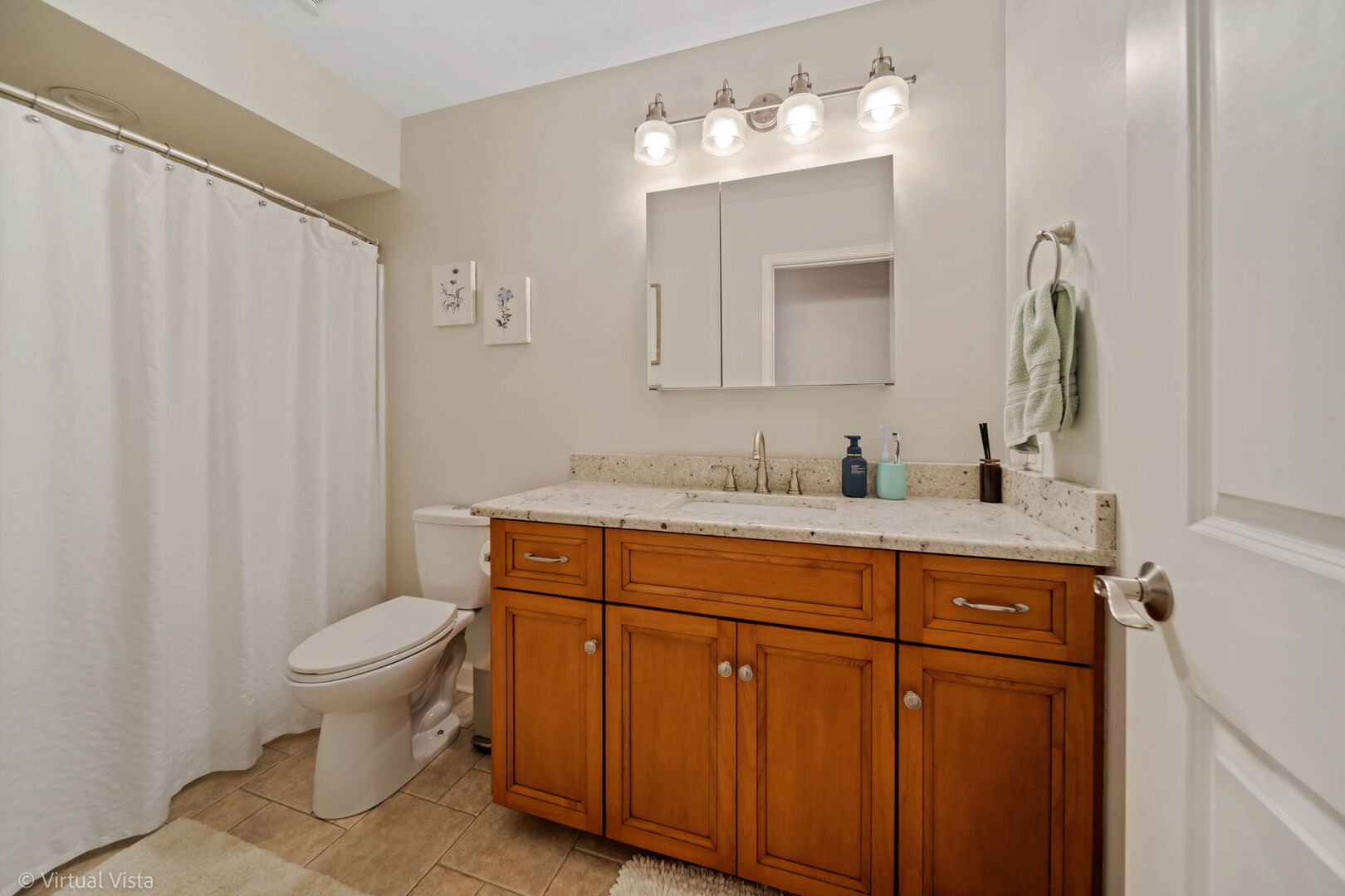 506 South Raven Road Shorewood, IL 60404 - Photo 25 of 37 a bathroom with a granite countertop sink a toilet and a mirror