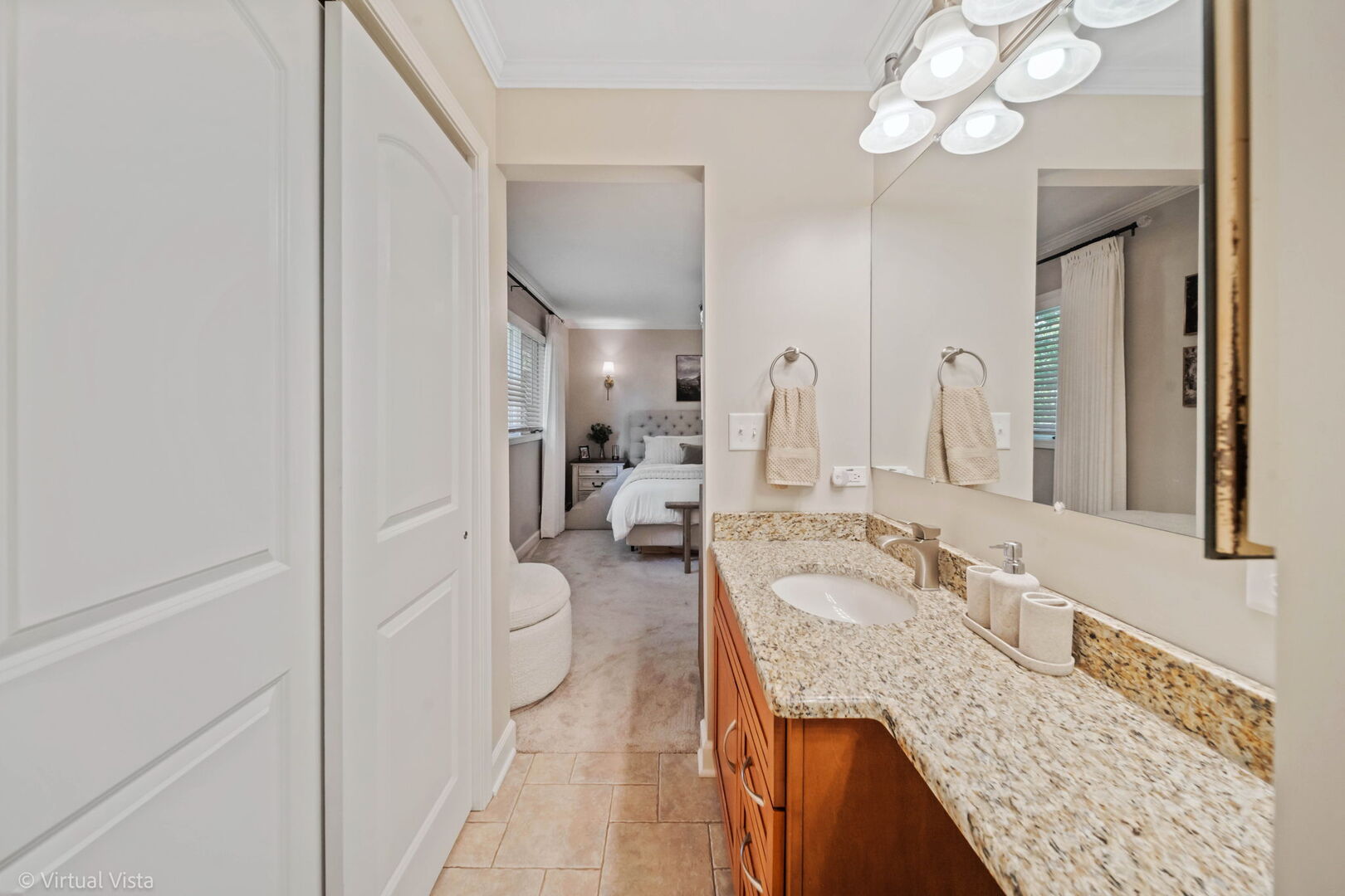 506 South Raven Road Shorewood, IL 60404 - Photo 27 of 37 a en suite bathroom with a granite countertop sink and a mirror