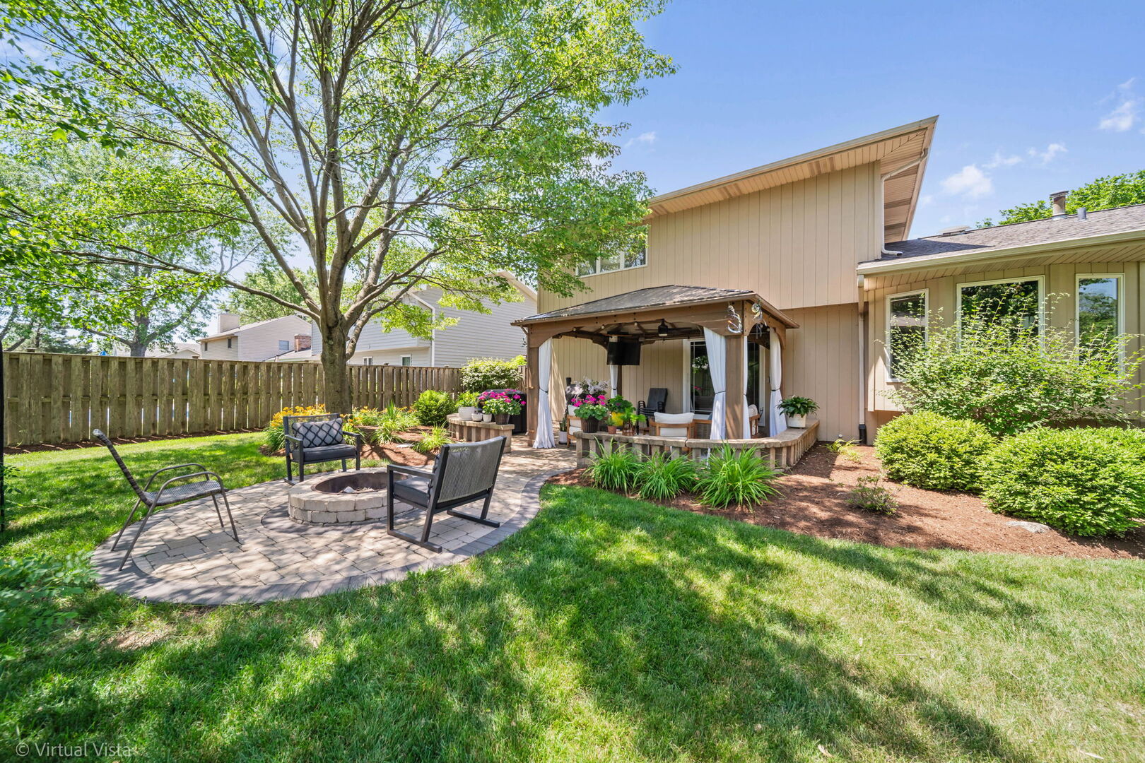 506 South Raven Road Shorewood, IL 60404 - Photo 30 of 37 a view of a house with a backyard and a patio