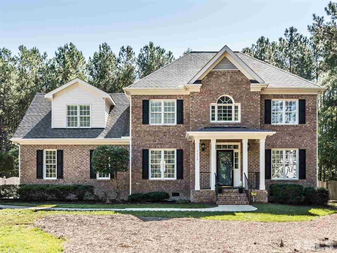 4408 Thistlehill Court Raleigh, NC 27616 - Photo 1 of 25 a front view of a house with a yard