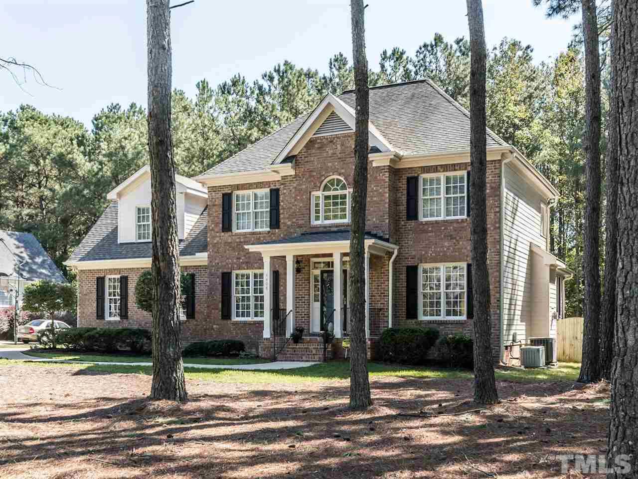 4408 Thistlehill Court Raleigh, NC 27616 - Photo 2 of 25 a front view of a house with a yard