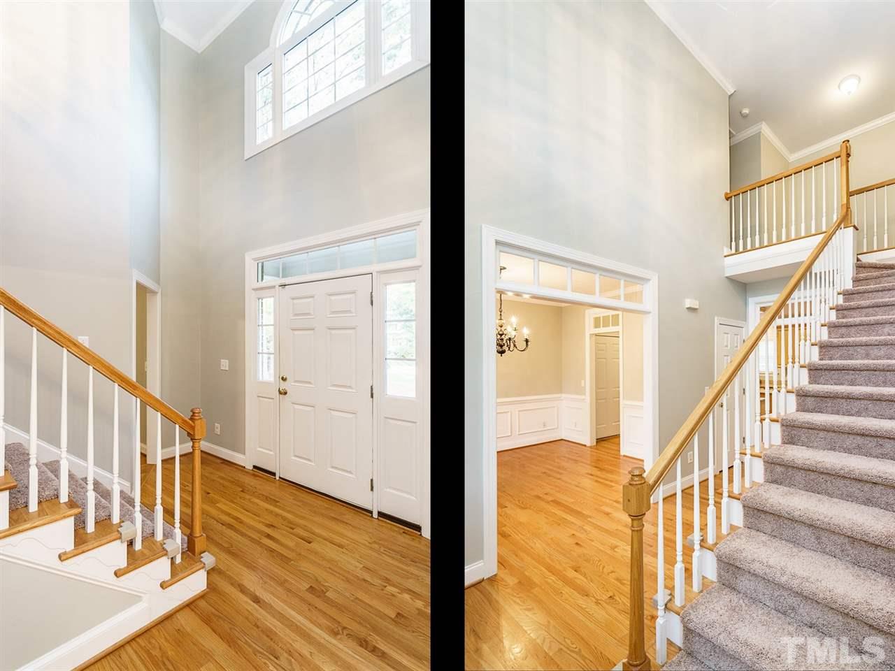 4408 Thistlehill Court Raleigh, NC 27616 - Photo 3 of 25 a view of a hallway with wooden floor and staircase