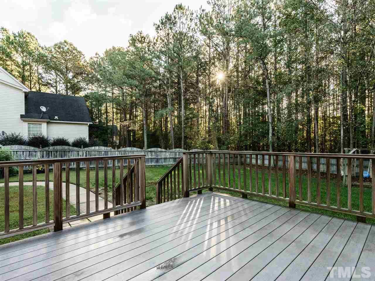 4408 Thistlehill Court Raleigh, NC 27616 - Photo 21 of 25 a view of balcony with wooden floor and fence