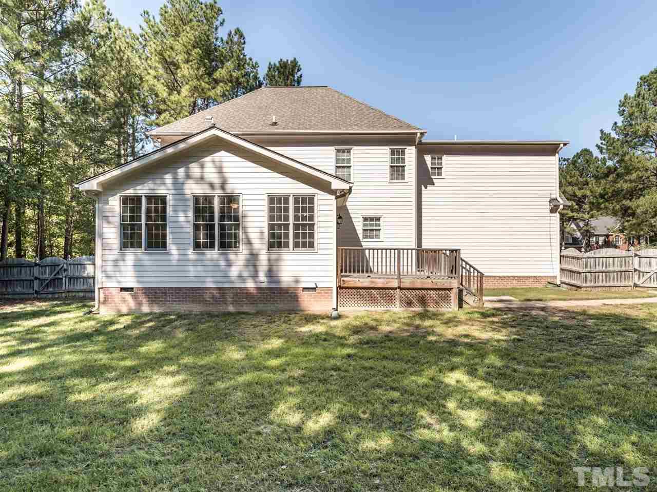 4408 Thistlehill Court Raleigh, NC 27616 - Photo 23 of 25 a house with green field in front of it