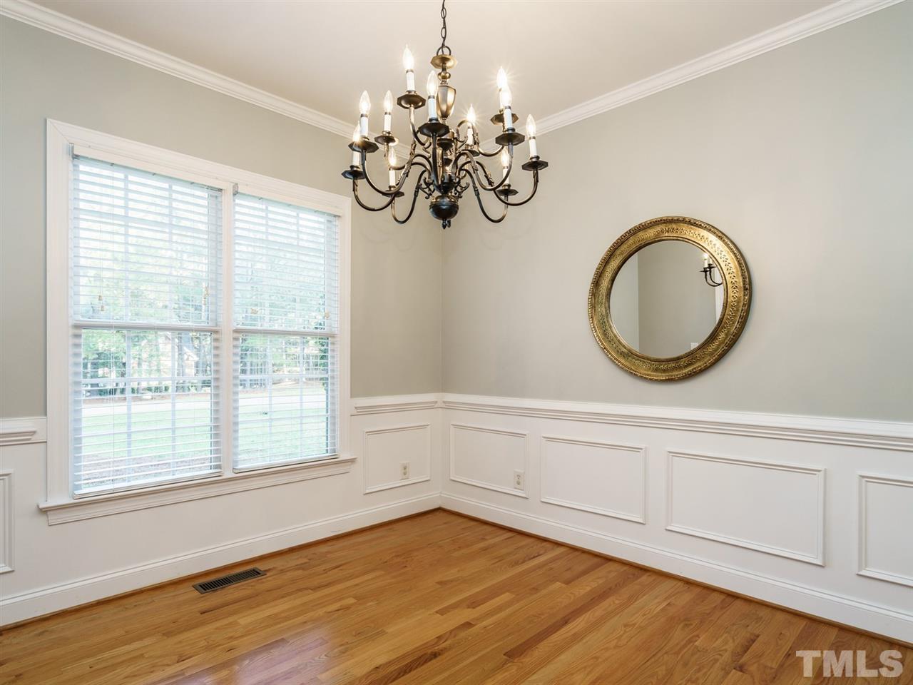 4408 Thistlehill Court Raleigh, NC 27616 - Photo 4 of 25 a view of a room with wooden floor and chandelier
