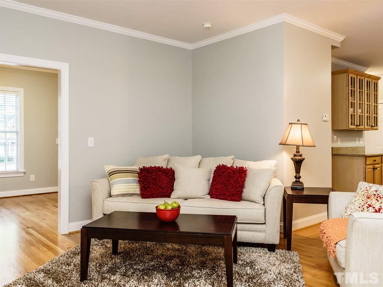 4408 Thistlehill Court Raleigh, NC 27616 - Photo 7 of 25 a living room with furniture and a wooden floor