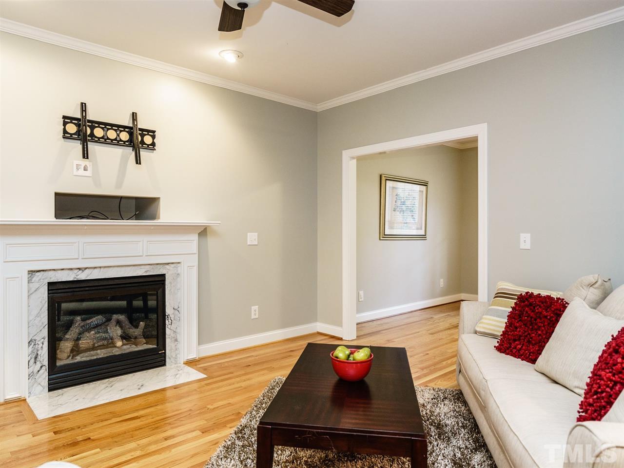4408 Thistlehill Court Raleigh, NC 27616 - Photo 8 of 25 a living room with furniture and a fireplace