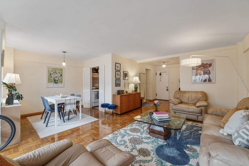 Undisclosed Address Manhattan, NY 10065 - Photo 3 of 10 a living room with furniture and wooden floor
