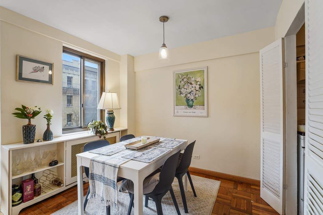 Undisclosed Address Manhattan, NY 10065 - Photo 4 of 10 a view of a dining room with furniture and wooden floor