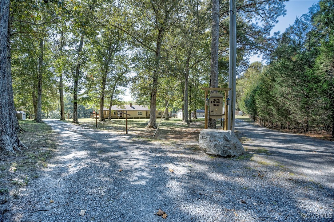 4275 Rockhill Road Mechanicsville, VA 23111 - Photo 11 of 43 a backyard of a house with lots of green space