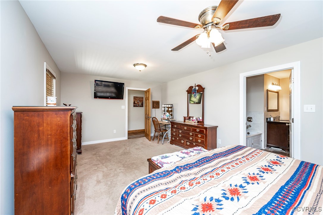 4275 Rockhill Road Mechanicsville, VA 23111 - Photo 35 of 43 a bedroom with bed and a chandelier