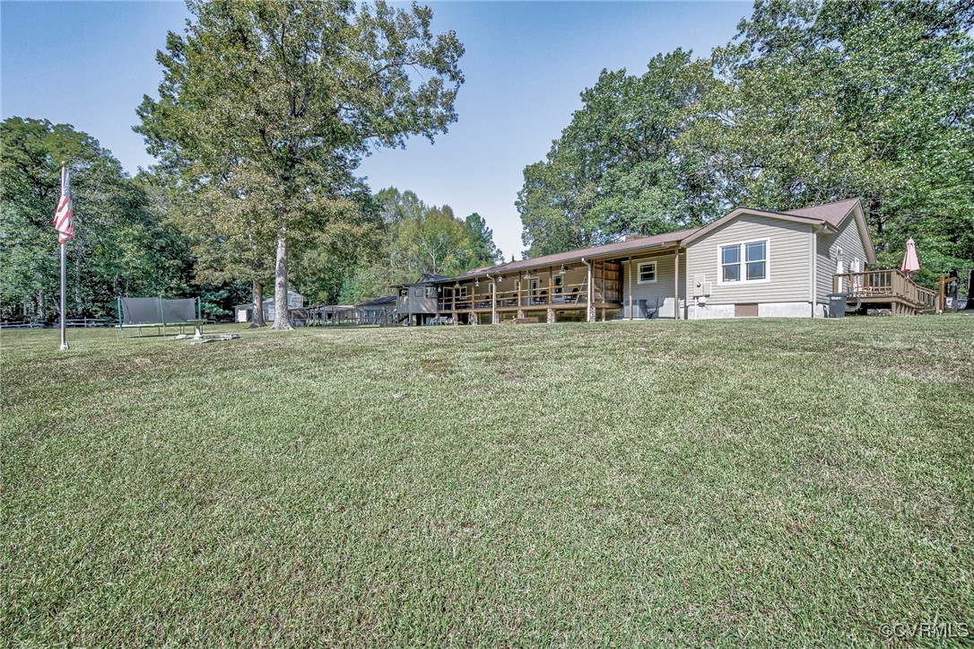 4275 Rockhill Road Mechanicsville, VA 23111 - Photo 6 of 43 a house with trees in the background