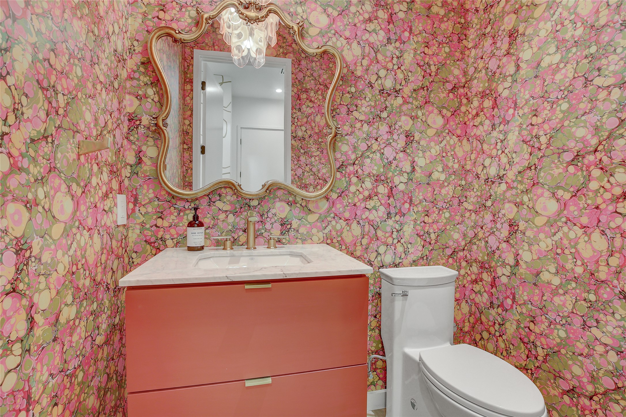 2006 Ford Street Austin, TX 78704 - Photo 25 of 40 Half bathroom with vanity and wallpapered walls on main floor