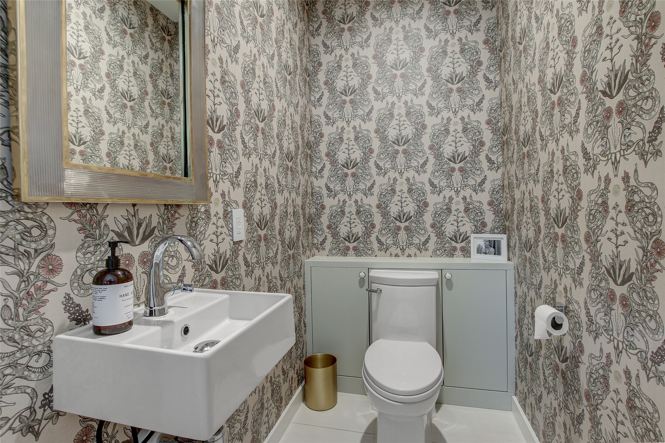 2006 Ford Street Austin, TX 78704 - Photo 36 of 40 Half bathroom on second floor with wallpapered walls and tile patterned floors