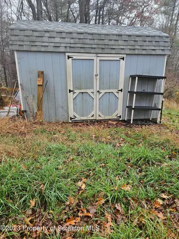 a view of a door and a window