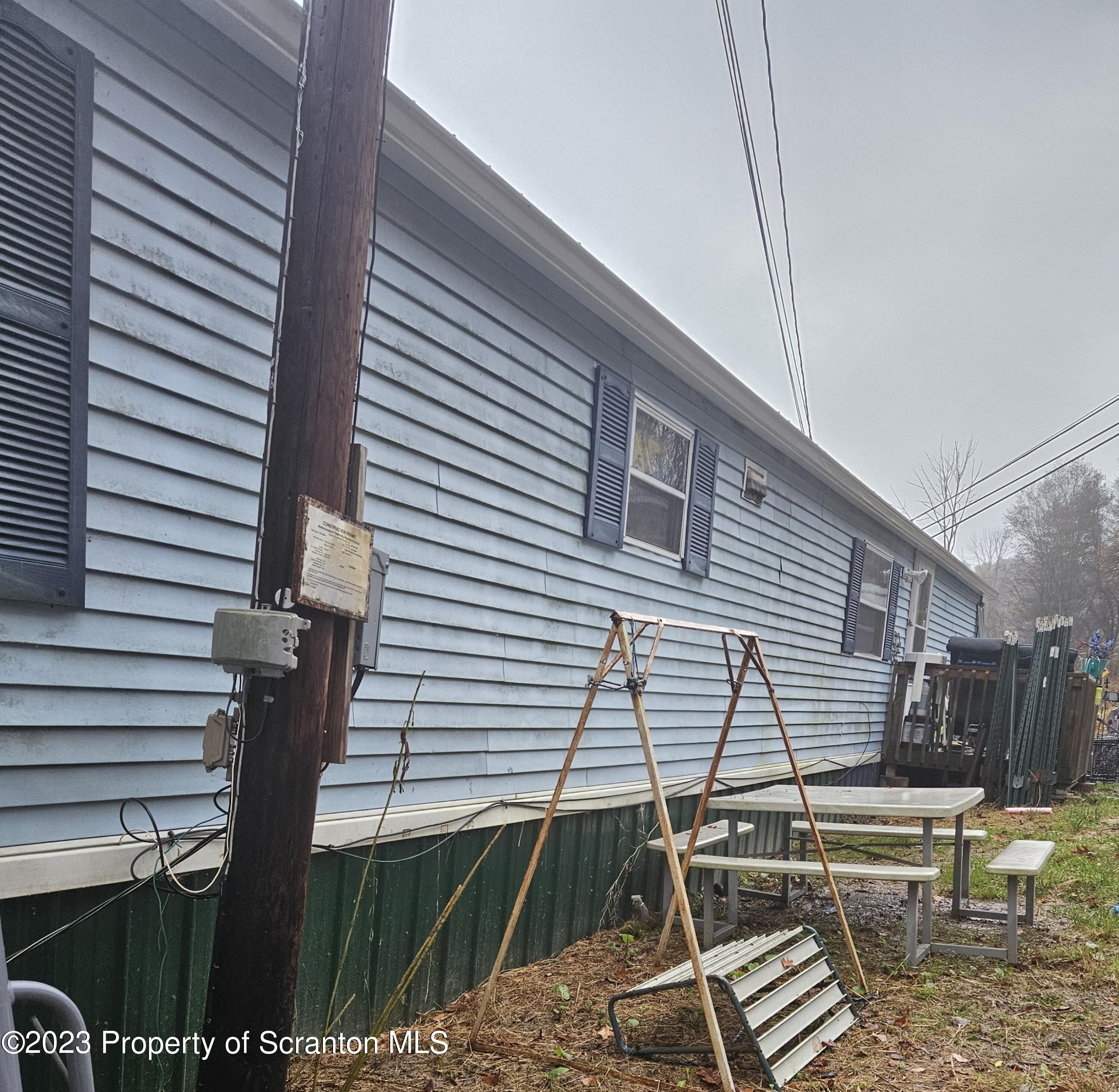 1262 Demunds Road Dallas, PA 18612 - Photo 8 of 15 a front view of a house with balcony