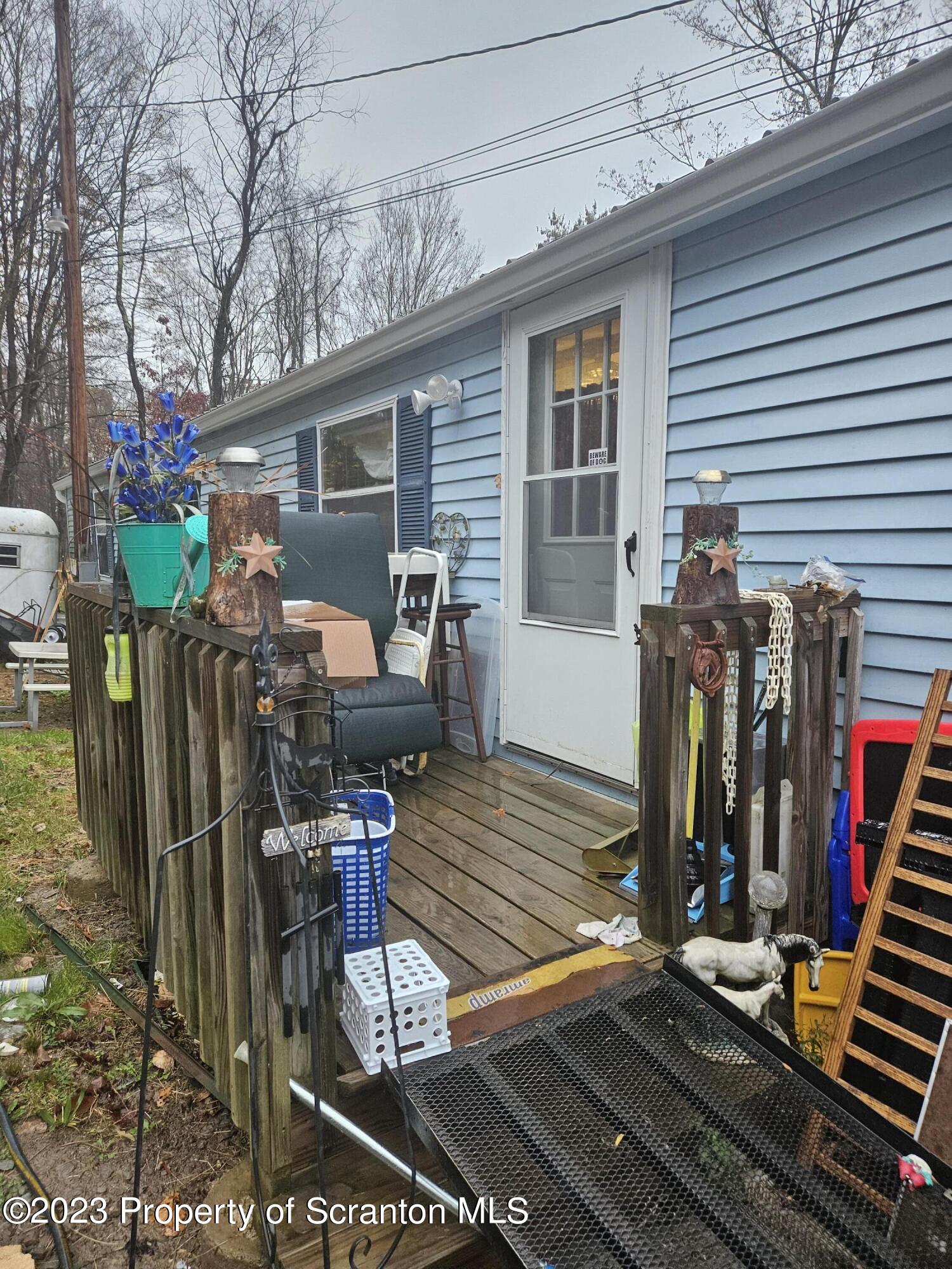 1262 Demunds Road Dallas, PA 18612 - Photo 9 of 15 a view of a dinning tables and chairs in patio