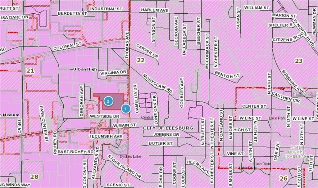 Thomas Avenue Leesburg, FL 34748 - Photo 3 of 4 a sign that is on a pink street