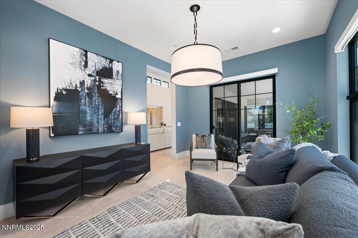 20555 Latour Way Reno, NV 89511 - Photo 20 of 59 a living room with furniture ceiling fan and a rug