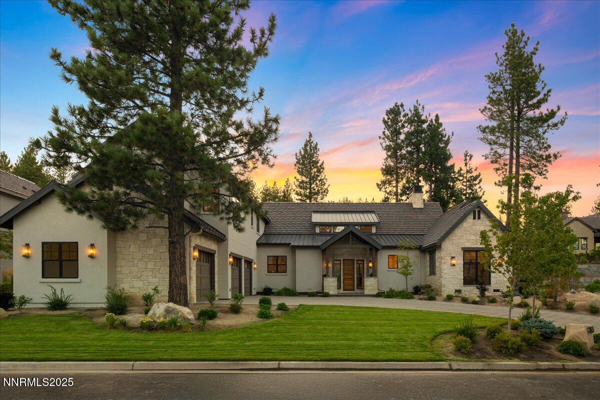 20555 Latour Way Reno, NV 89511 - Photo 2 of 59 a front view of a house with a garden and trees