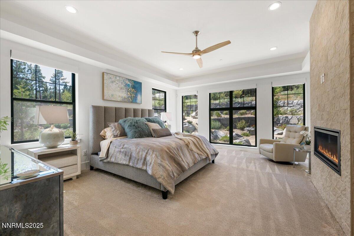 20555 Latour Way Reno, NV 89511 - Photo 21 of 59 a spacious bedroom with a large bed and a large window
