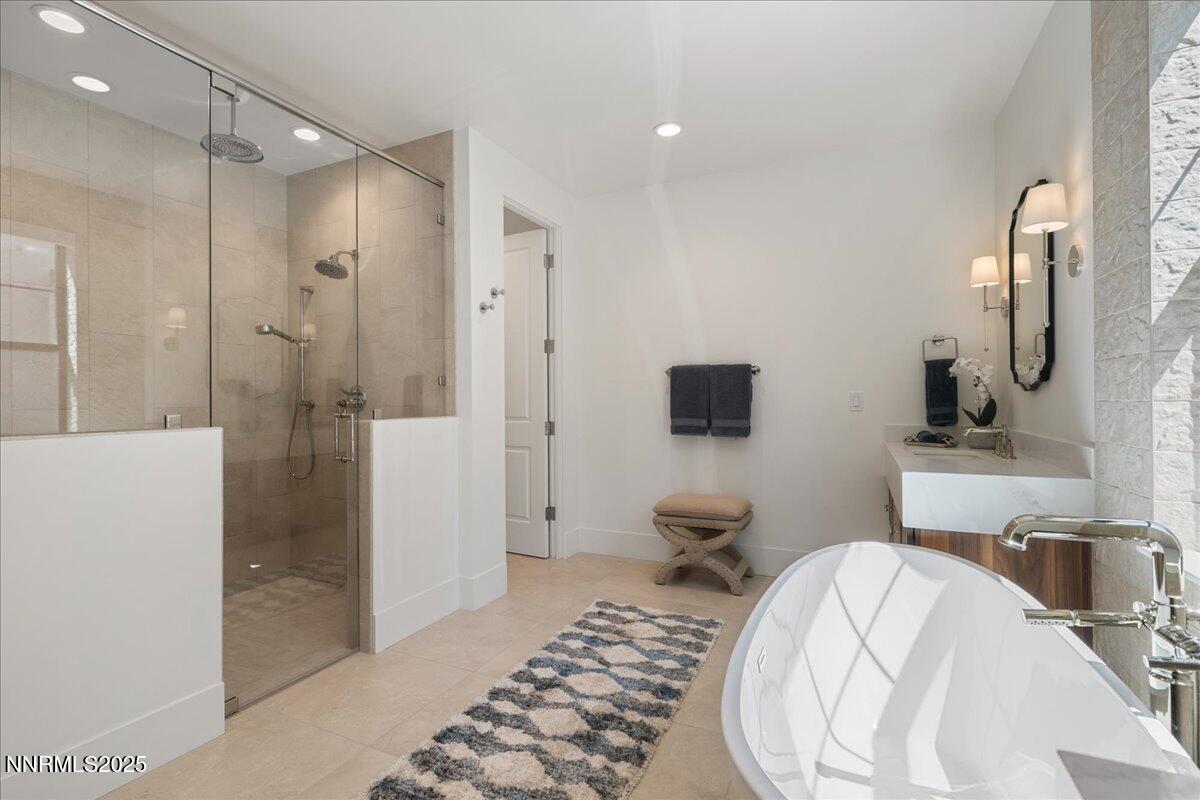 20555 Latour Way Reno, NV 89511 - Photo 26 of 59 a spacious bathroom with a bathtub and a shower