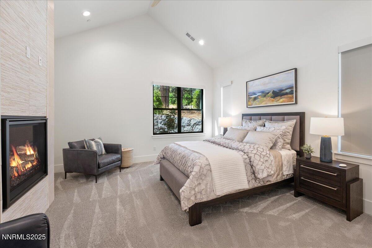 20555 Latour Way Reno, NV 89511 - Photo 27 of 59 a bedroom with a bed and a couch