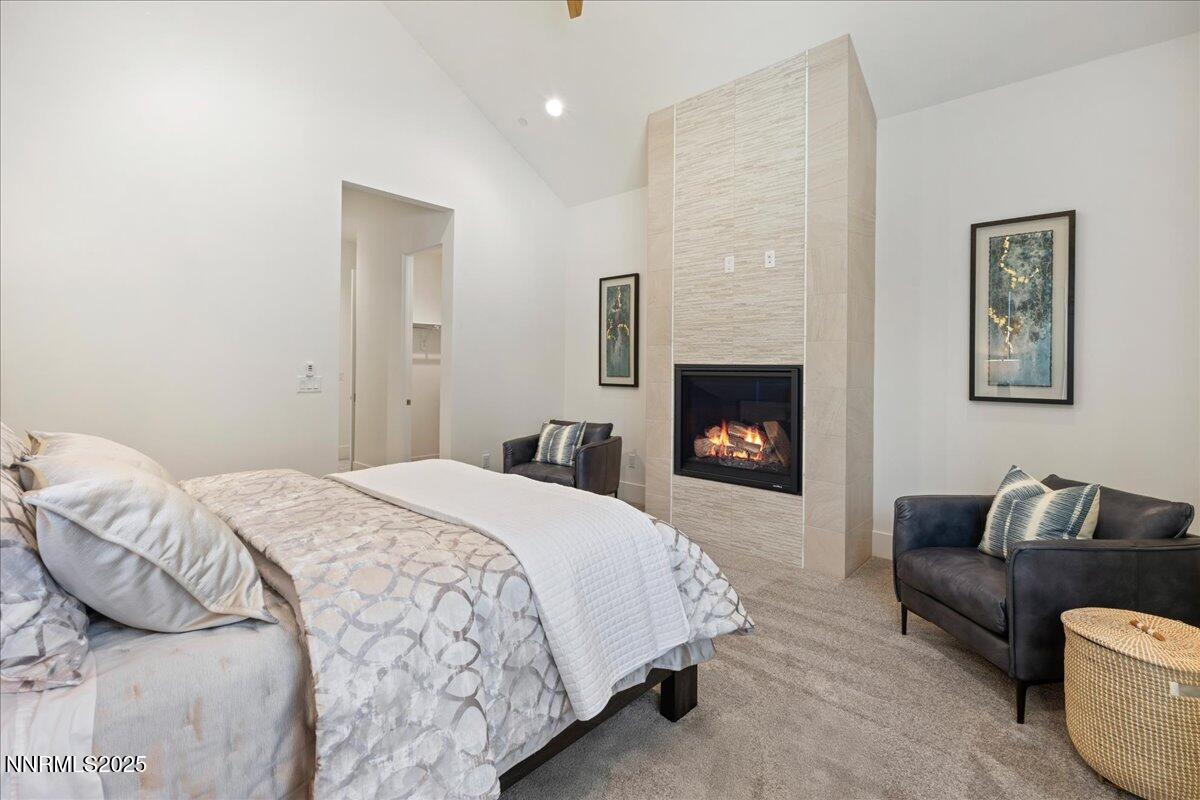 20555 Latour Way Reno, NV 89511 - Photo 28 of 59 a bedroom with a bed and a fireplace