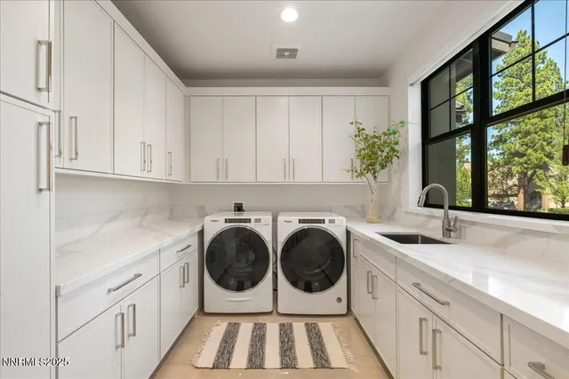 a living room with furniture a chandelier and a couch